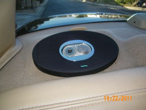 2003 Ford Crown Victoria - Close view of an Infinity speaker set into the tan rear parcel shelf