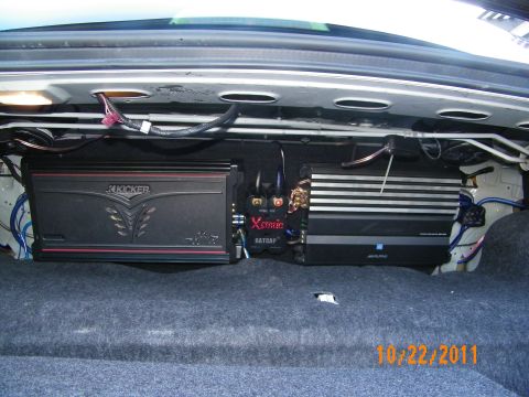 2003 Ford Crown Victoria - Two car amplifiers, Kicker and Alpine, wired across the rear package tray