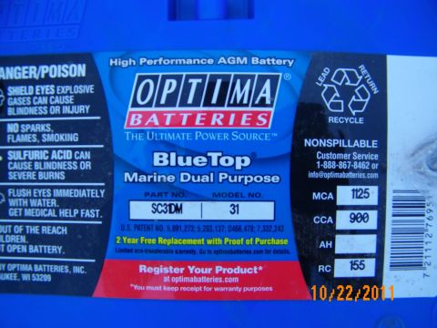 2003 Ford Crown Victoria - Close-up of an Optima BlueTop battery label listing part number SC31DM and specs