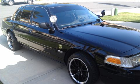 2003 Ford Crown Victoria - Black Crown Victoria with police-style pillar spotlight, 4.6 fender badge and black wheels