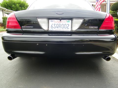 2003 Ford Crown Victoria - Crown Victoria Limited rear bumper view, California plate 6SQR002, twin chrome exhaust outlets