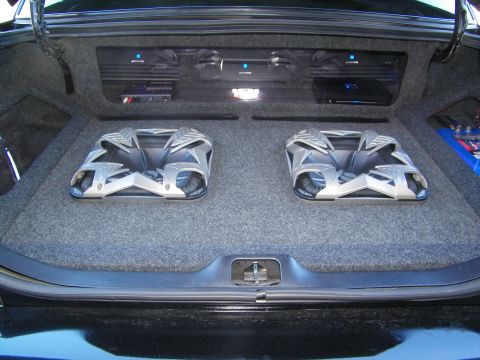 2003 Ford Crown Victoria - Symmetrical trunk install, twin Kicker subs below an amp shelf of Alpine units