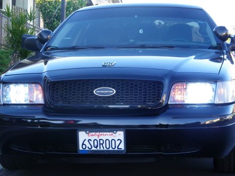 2003 Ford Crown Victoria - Close front shot of a Crown Victoria showing the Interceptor grille emblem and lamps