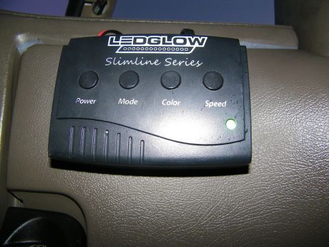 2003 Ford Crown Victoria - LEDGlow Slimline Series control box mounted to a tan interior panel, four labeled buttons visible.
