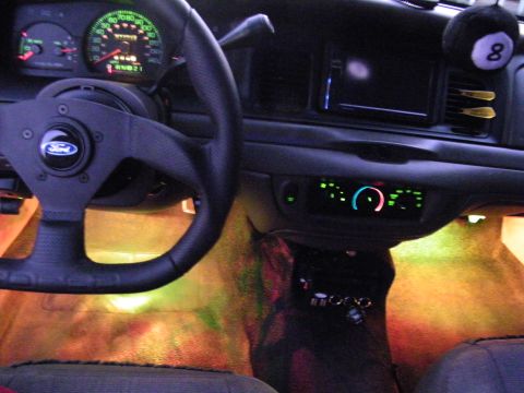 2003 Ford Crown Victoria - Ford interior featuring an 8-ball shift knob, small sport wheel, and warm LED footwell lighting.