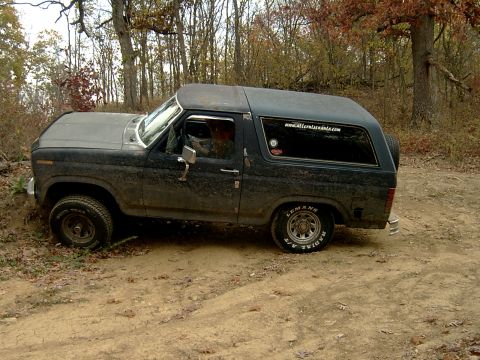 1982 Ford Bronco - This Ford Bronco is seen off-road in a wooded area.