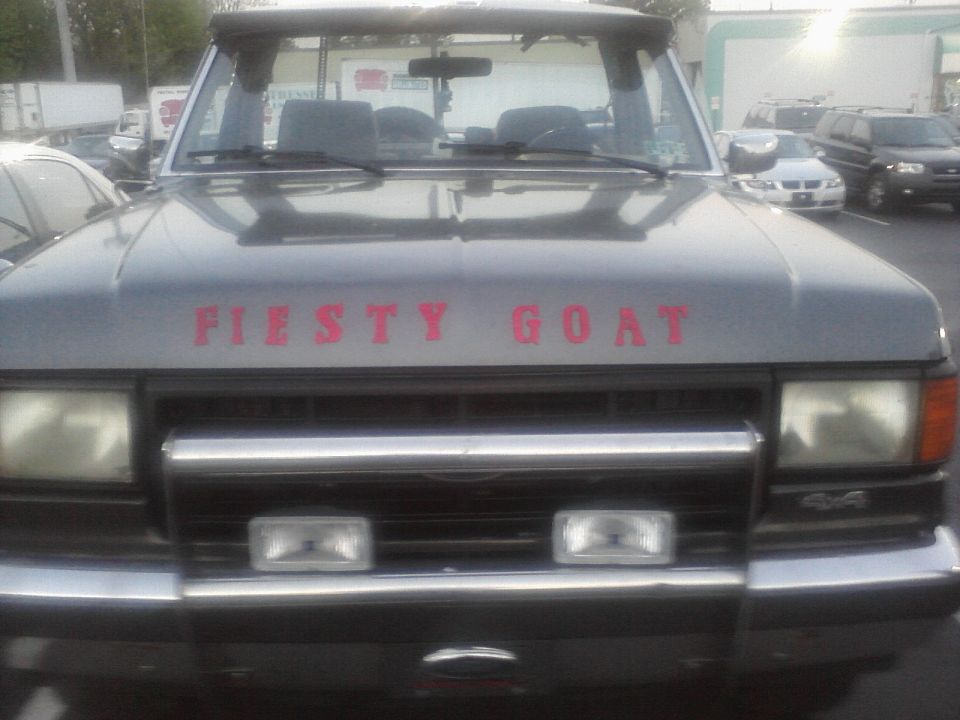 1988 Ford Bronco front view with "FIESTY GOAT" text on hood