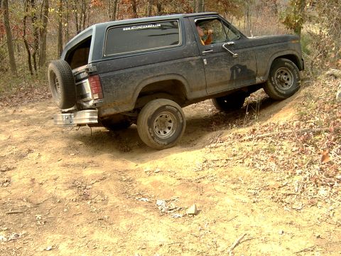 1982 Ford Bronco - This 1980s Ford Bronco navigates a challenging off-road path, its capabilities.