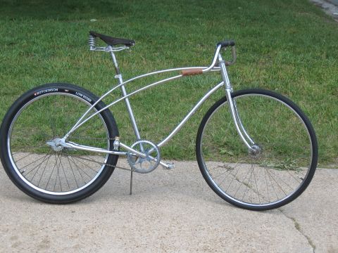 1994 Ford Bronco - A custom cruiser bicycle with a chrome frame and vintage-style details sits on a sidewalk.