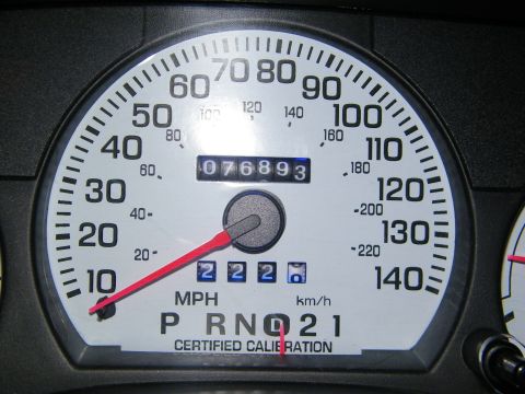 2003 Ford Crown Victoria - White-faced 140 MPH speedometer showing odometer 076893 and Certified Calibration text