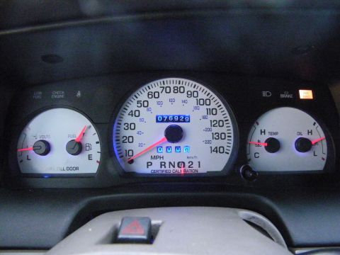 2003 Ford Crown Victoria - Dashboard gauge panel with speedometer, fuel, volts, temp and oil gauges, odometer 076926