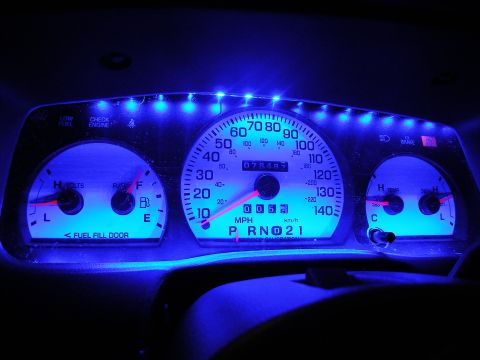 2003 Ford Crown Victoria - Blue-lit instrument panel with white gauges, speedometer to 140 MPH, odometer 073491