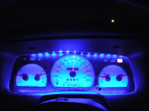 2003 Ford Crown Victoria - Gauge panel glowing bright blue with row of LEDs above the 140 MPH speedometer