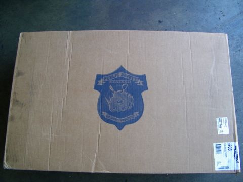 2003 Ford Crown Victoria - Sealed shipping carton printed with a rhino crest reading Public Safety Division and a shipping label