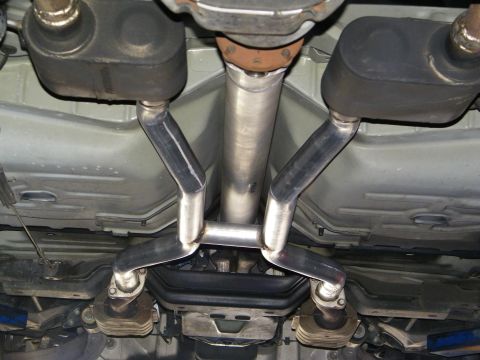 2003 Ford Crown Victoria - Stainless dual exhaust crossover routed over a suspension crossmember on a lift