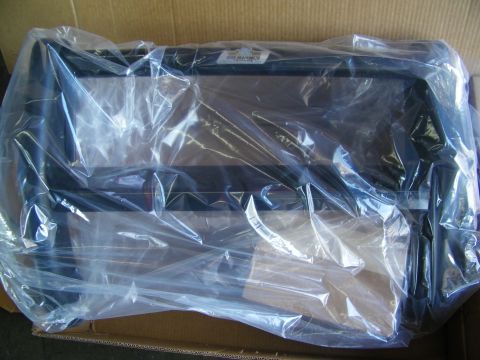 2003 Ford Crown Victoria - Black grille guard wrapped in plastic inside its shipping box with a product label