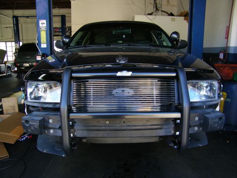 2003 Ford Crown Victoria - Installed black grille guard fronting a Ford truck with billet grille and blue oval badge