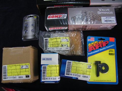 2003 Ford Crown Victoria - Close-up of COMP Cams valve spring box, ARP bolt pack and Ford parts cartons.