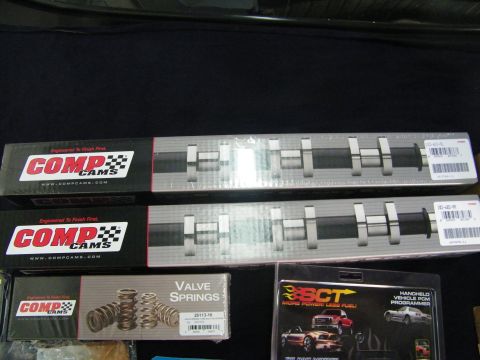 2003 Ford Crown Victoria - COMP Cams camshaft boxes with valve springs and an SCT programmer advertisement.
