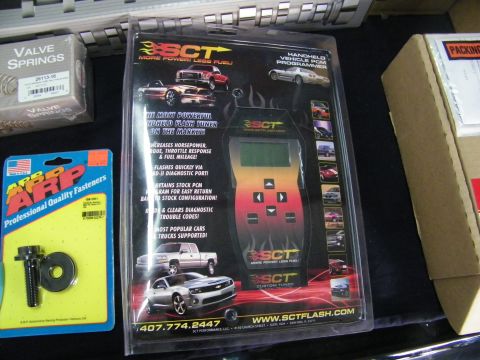2003 Ford Crown Victoria - SCT custom tuner flash device packaged beside ARP hardware and COMP valve springs.