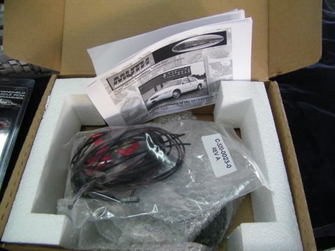 2003 Ford Crown Victoria - Boxed kit containing coiled wiring, an instruction booklet and a labeled parts bag.