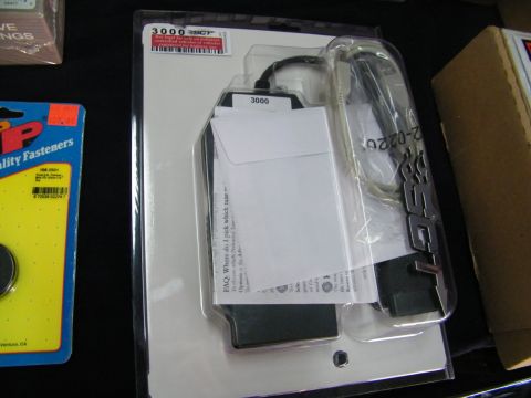 2003 Ford Crown Victoria - Packaged SCT 3000 flash programmer and harness next to a pack of ARP fasteners.