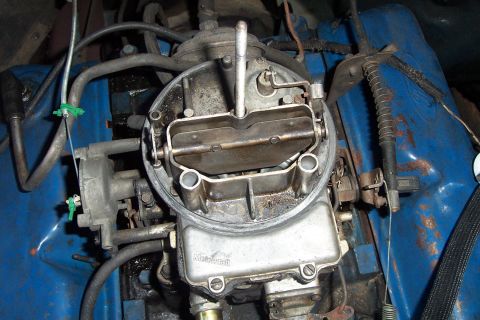 1980 Ford Bronco - Close-up of a Holley carburetor, likely from an older vehicle's engine bay.