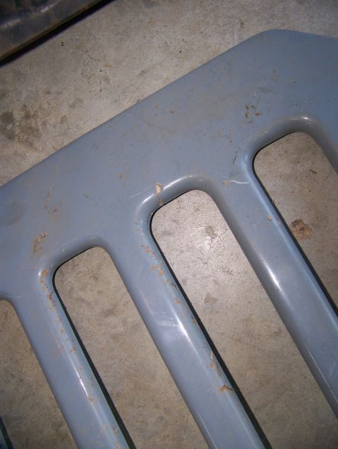 2000 Jeep Wrangler - Close-up of a gray Jeep grille, showing some wear and tear.