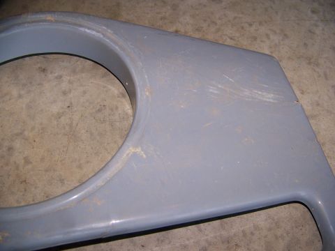 2000 Jeep Wrangler - Close-up of a gray plastic fender flare, likely for an off-road vehicle, showing wear and tear.
