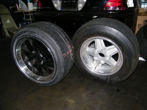 2003 Ford Crown Victoria - Comparison of a black polished-lip wheel and a silver wheel mounted with a drag slick