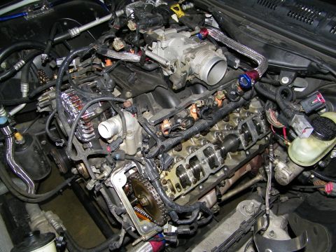 2003 Ford Crown Victoria - Close view of a partially stripped V8 with timing chain and rocker arms visible