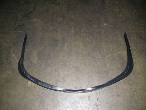 2003 Ford Crown Victoria - Single black molded front bumper valance trim resting on a garage concrete floor