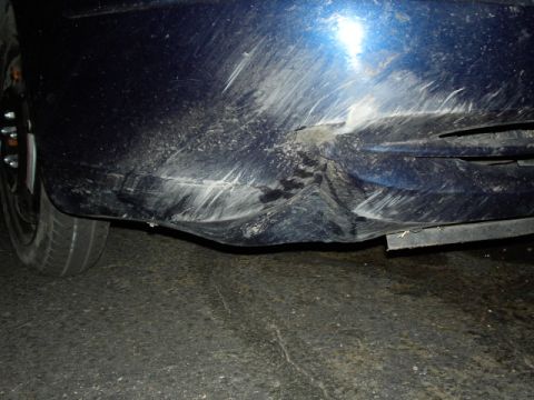 2001 Ford Taurus - Bumper damage after running into a drainage ditch for an on-ramp to I-25