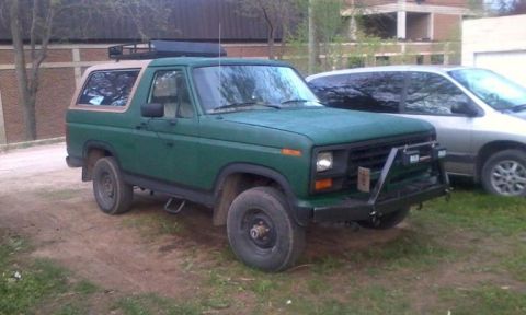 1986 Ford Bronco - This 1986 Ford Bronco is seen from a 3/4 front view, a roof rack and a custom bumper.