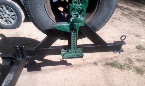 1986 Ford Bronco - The hinge is a glorified trailer wheel bearing from comp4x4.com. Opens smoothly and is very strong. Since the spindle fits inside the bumpe…