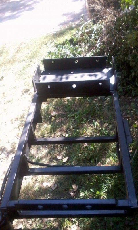 1986 Ford Bronco - Version 1.5 of the cooler rack. A water jug sits on that plate, which is high enough to clear the hitch and trailer tongue when closed. Sti…