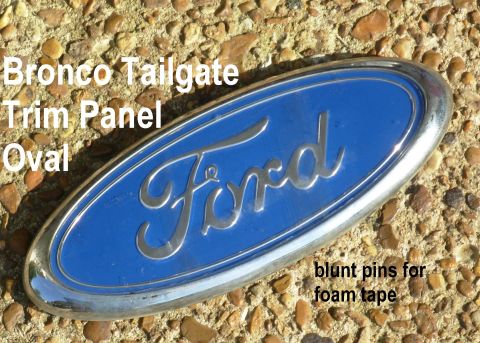 1983 Ford Bronco - Bronco Tailgate Trim Panel Blue Oval (E7TZ-9842528-A) IF THE IMAGE IS TOO SMALL, click it. Alignment pegs are blunted.