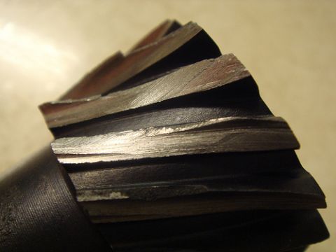 1990 Ford Bronco - This is a close-up view of a gear cutter tool, showing its sharp, metallic teeth.