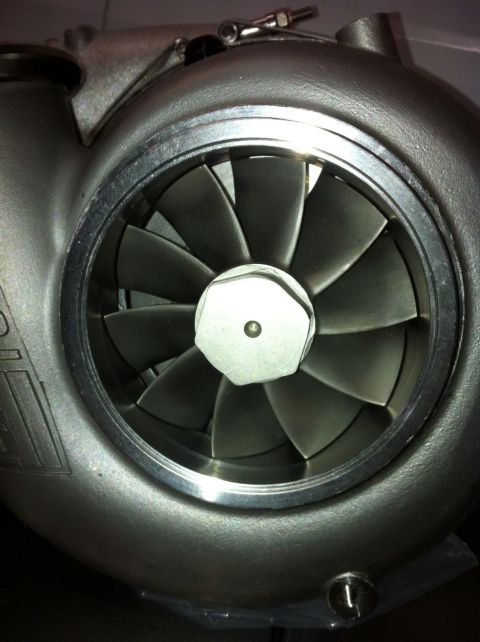 1965 Ford Fairlane - Close-up of a turbocharger's compressor wheel, showing its intricate blade design.