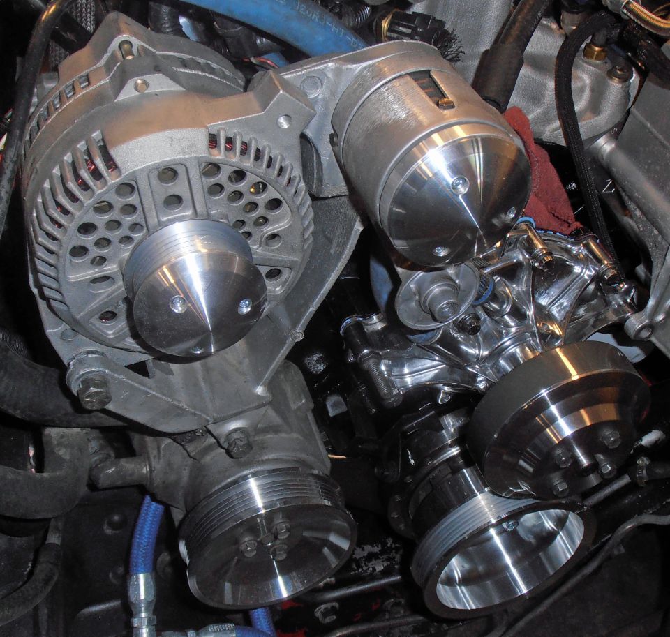 Engine pulleys and alternator with blue hoses and red rag
