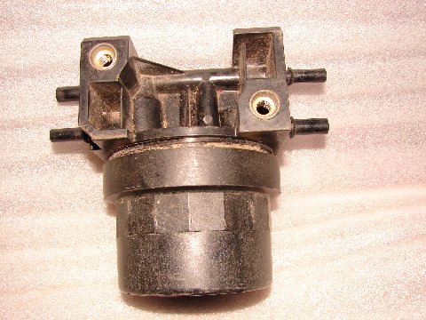 1973 Ford Ranchero - This is a close-up view of a vehicle's fuel filter, a component used to remove contaminants from fuel.