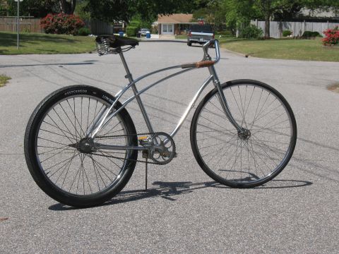1994 Ford Bronco - A custom bicycle with a unique frame design sits on a suburban street.