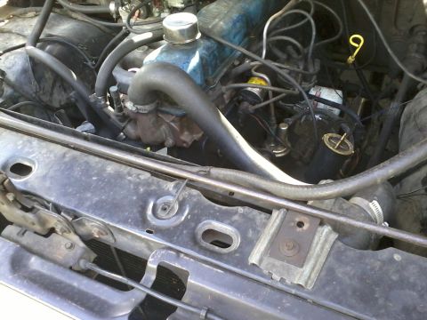 1981 Ford Bronco - Close-up view of an engine bay, showing the engine block, hoses, and other components.