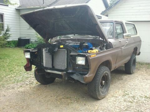 1979 Ford Bronco - This 1978 Ford Bronco has its hood open, revealing the engine bay.