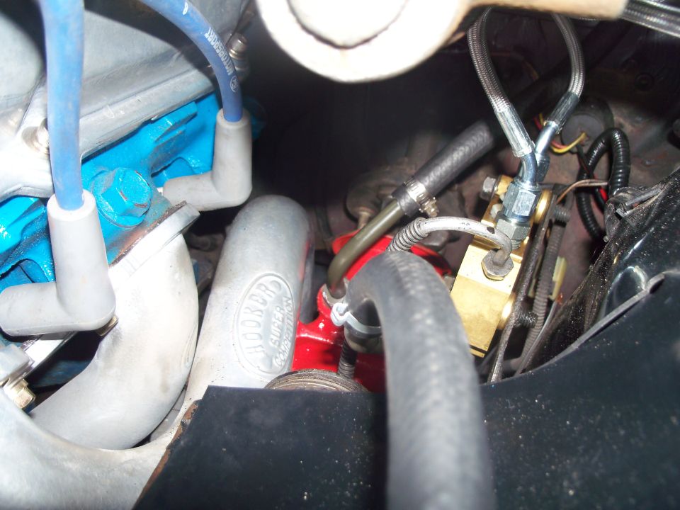 Hooker header clearance to quick ratio steering box, fabbed P/S pressure line for hydraulic shop. 4 wheel Disc brake prop/combination valve with braided brake feed lines from 1 1/8" Corvette MC.