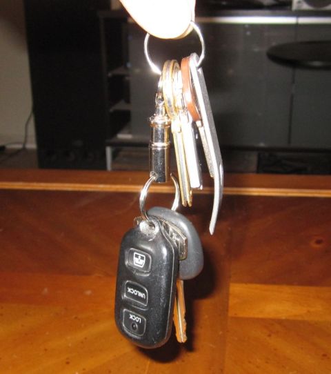 1990 Ford Bronco - Keychain with car remote and keys, including a remote with unlock and lock buttons.