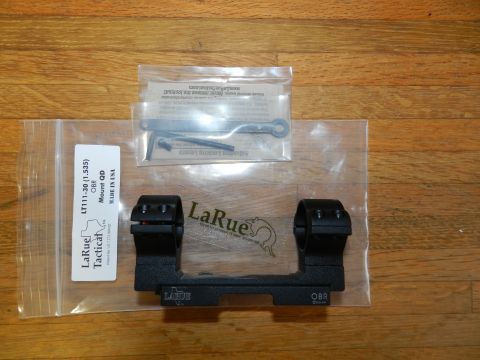 1996 Ford Bronco - A LaRue Tactical scope mount, model LT111-30, is shown with its accessories on a wooden surface.