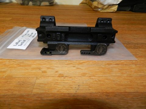 1996 Ford Bronco - A LaRue Tactical scope mount is shown on a wooden table, with packaging in the background.