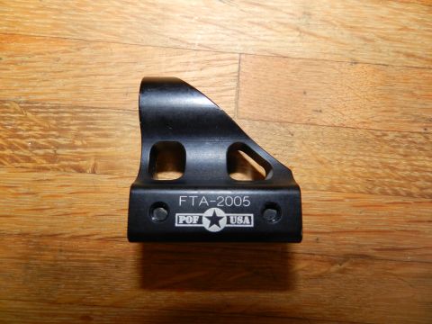 1996 Ford Bronco - A black metal bracket, marked "FTA-2005" and "POF USA", is shown against a wooden background.