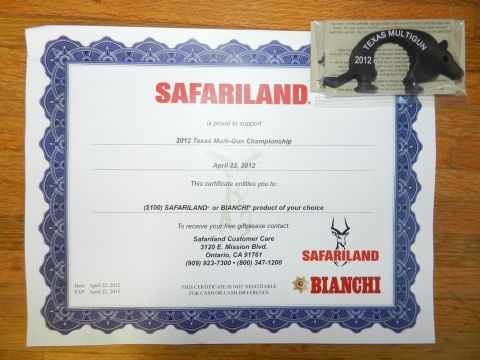 1996 Ford Bronco - A certificate and a small black figurine are displayed on a wooden surface.